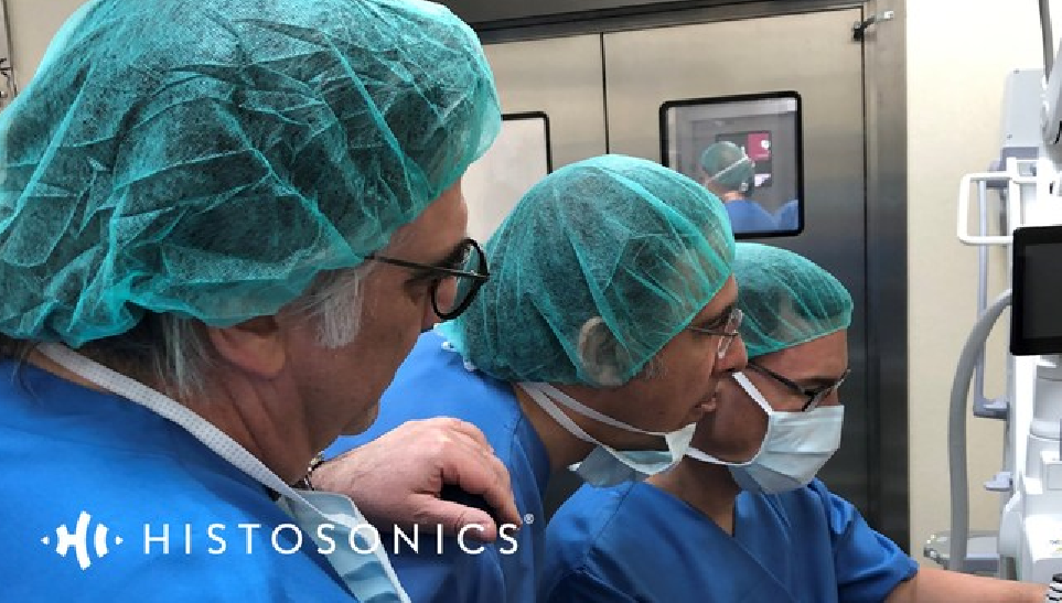 Three doctors review a procedure together